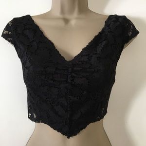 Free People black lace crop top. NWT. Size small